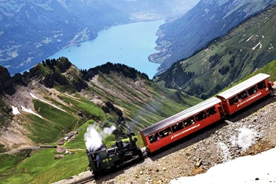 Swiss Train Passing Through Beautiful Swiss Alps